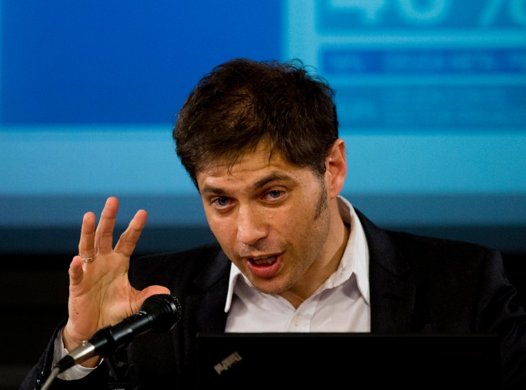 Argentina's Economy MInister Axel Kicillof talks to the media at a press conference to explain the recent U.S. Supreme Court's ruling on Argentina's bond default, in Buenos Aires, Argentina, Tuesday, June 17, 2014. The Argentine economy minister says the government is working on a debt swap that would make payments in Argentina to creditors who accepted previous debt restructurings. (AP Photo/Eduardo Di Baia)