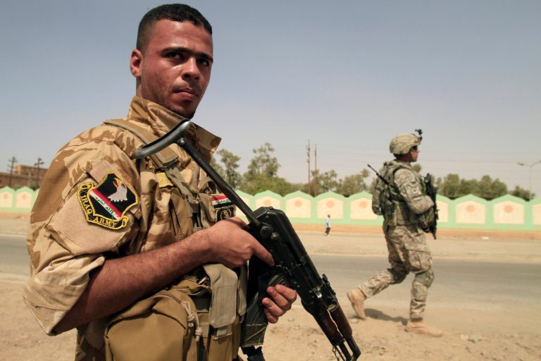FILE - In this Oct. 6, 2010, file photo, an armed Sunni militiaman wearing an Iraqi Army patch, left, and a U.S. Army soldier patrol in Samarra, 60 miles (95 kilometers) north of Baghdad, Iraq. The man is part of Samarra's Sahwa _ Arabic for Awakening, or commonly known as the Sons of Iraq, who are former Sunni insurgents now allied with U.S. and Iraqi security forces to provide security. The Obama administration is reaching back to an Iraq War program as a guide to keep disgruntled Sunnis from joining a rampant new insurgency. U.S. officials hope to persuade Sunni militiamen known as Sahwa, or Awakening Councils, to fight back against the Islamic State of Iraq and the Levant as they did nearly 10 years ago against al-Qaida. The Awakening Councils sided with U.S. troops and were a pivotal force in defeating al-Qaida during the war.  (AP Photo/Maya Alleruzzo)