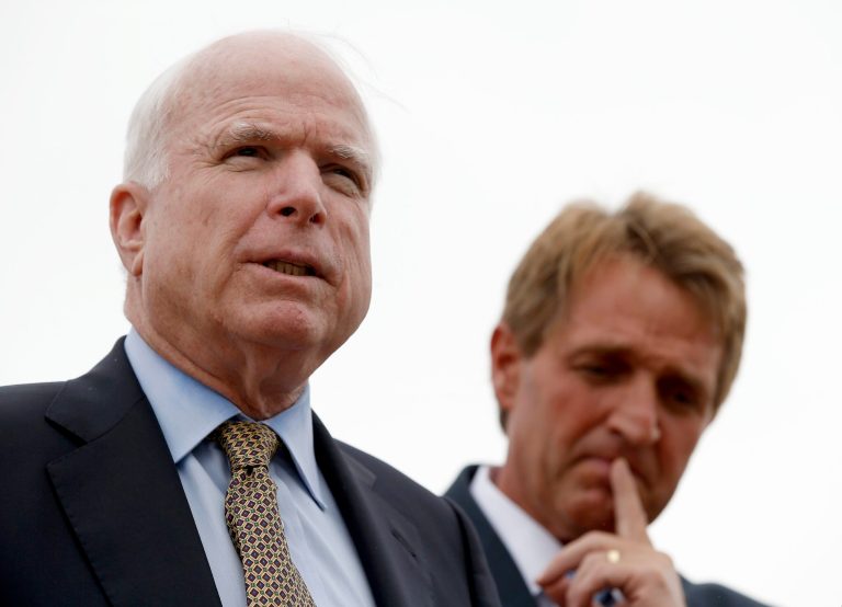 Sens. McCain, left, and Jeff Flake wrote that they are 