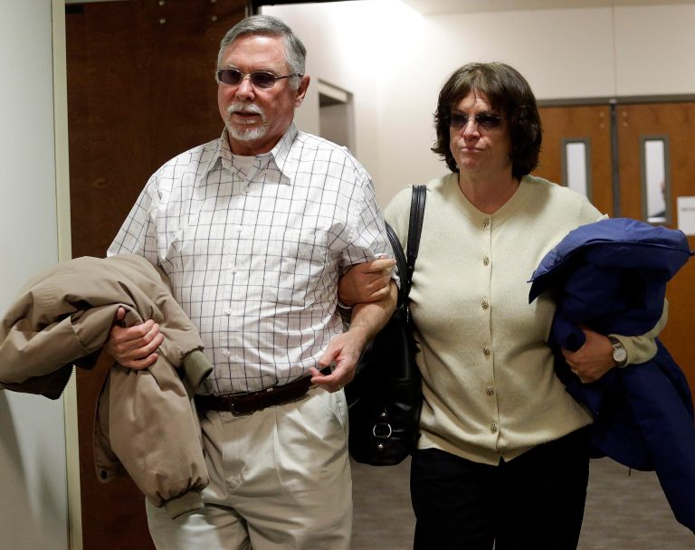 James Holmes parents Robert and Arlene Holmes arrive at district court for the arraignment of their son Aurora theater shooting suspect James Holmes in Centennial, Colo., on Tuesday, March 12, 2013. The judge has entered a not guilty on behalf of James Holmes after his lawyer said he's not ready to enter a plea. Holmes is charged with killing 12 people and wounding more than 50 in a crowded Colorado movie theater last year. (AP Photo/Ed Andrieski)