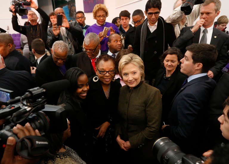 Democratic presidential candidate Hillary Clinton poses for a photograph at the House Of Prayer Missionary Baptist Church, Sunday, Feb. 7, 2016 in Flint, Mich. (AP Photo/Paul Sancya)