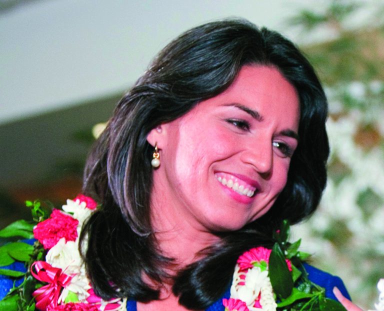 FILE This Nov. 6, 2012 file photo shows Iraq war veterans Rep.-elect Tulsi Gabbard in Honolulu. Veterans groups say the influx of Iraq and Afghanistan veterans in Congress is welcome because it comes at a time when the overall number of veterans in Congress is on a steep and steady decline. In the mid-1970s, the vast majority of lawmakers tended to be veterans. (AP Photo/Marco Garcia, File)