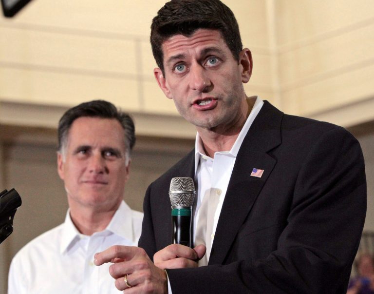 Republican presidential candidate, former Massachusetts Gov. Mitt Romney, left, listens as vice presidential running mate Rep. Paul Ryan, R-Wis., speaks at a rally at the Randolph Macon college,  Saturday, Aug. 11, 2012 in Ashland, Va.  (AP Photo/Mary Altaffer)