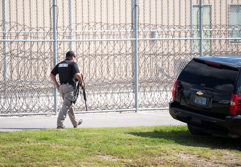 Law enforcement officers from a variety of agencies and counties surrounded the Willacy County Correctional Center in Raymondville, Texas, during prison unrest earlier this month. (AP Photo/Valley Morning Star, David Pike)