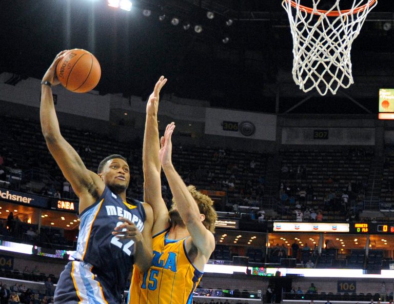   Memphis Grizzlies forward Rudy Gay (22) shoots over New Orleans Hornets center Robin Lopez (15) in the first half of an NBA basketball game in New Orleans, Friday Dec 7, 2012. (AP Photo/Stacy Revere)  