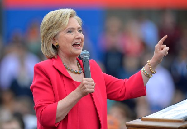 Clinton backs bill limiting revolving-door bonuses