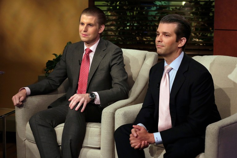 Eric Trump, left, and Donald Trump Jr., have been accused of selling access to their father through million-dollar donations through a new nonprofit organization they set up less than a week ago. (AP Photo/Richard Drew)