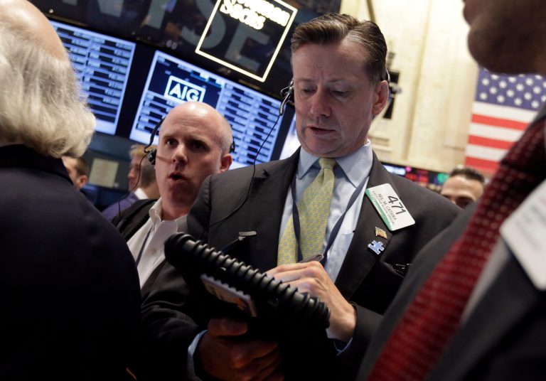 Trader Neil Catania, right, works on the floor of the New York Stock Exchange, Friday, May 23, 2014. Stocks inched higher early Friday in quiet trading ahead of the Memorial Day weekend.  (AP Photo/Richard Drew)