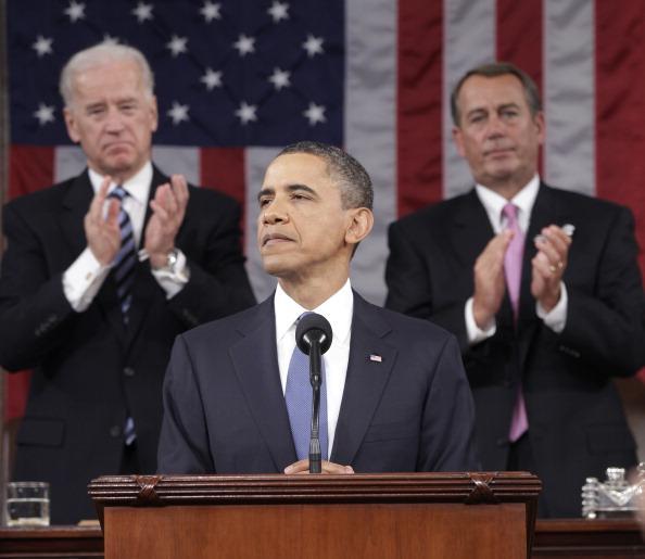 U.S. President Barack Obama (C) is applauded by U.S. Vice President Joe Biden (L) and Speaker of the House John Boehner (R-OH) while delivering his State of the Union address on Capitol Hill January 25, 2011 in Washington, DC. (Photo by Pablo Martinez Monsivais-Pool/Getty Images) 