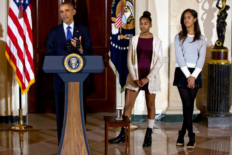 In this Nov. 26, 2014 file photo, President Barack Obama, joined by his daughters Malia, right, and Sasha, center, speaks at the White House, in Washington during the presidential turkey pardon ceremony, an annual Thanksgiving tradition. Elizabeth Lauten, an aide to a Republican congressman has resigned after her critical comments about President Barack Obama's daughters touched off a backlash. (AP Photo/Jacquelyn Martin, File)