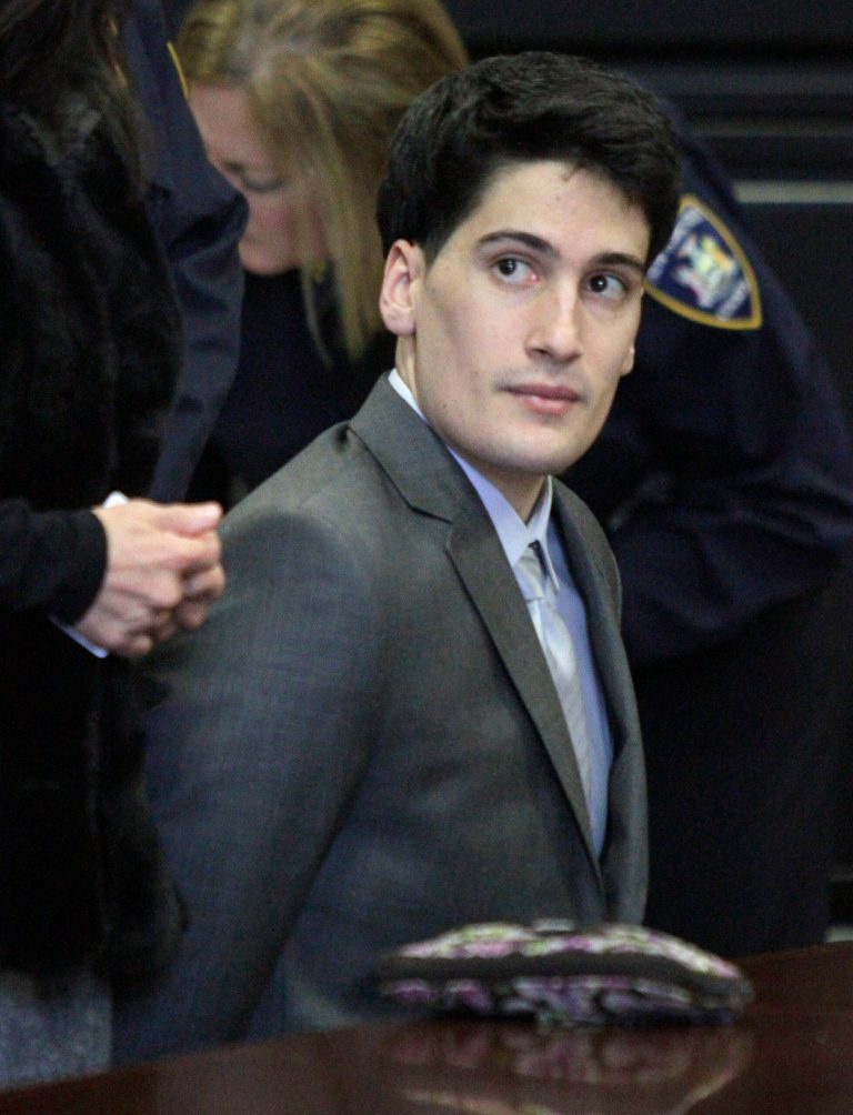   FILE - In this Friday, Feb. 17, 2012 file photo, Renato Seabra, a Portuguese model charged with castrating and killing Portuguese TV personality Carlos Castro in a New York hotel, listens while seated handcuffed at his court hearing in New York. Seabra was convicted last month of choking, bludgeoning and mutilating Castro and was sentenced Friday, Dec. 21, 2012, to 25 years to life in prison. (AP Photo/Bebeto Matthews, File)  