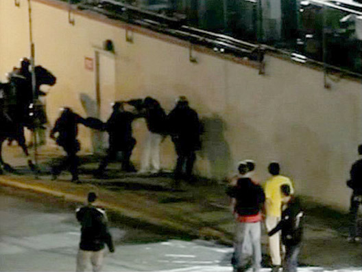   An image made from a March 3, 2010 videotape taken by a student from a dorm room window and provided by Roberts and Wood Law Firm shows Prince Georges County, Md., police allegedly beating University of Maryland student John McKenna. A police officer convicted of beating a University of Maryland student in 2010 after a rowdy student celebration that followed the Maryland basketball team's win over Duke is scheduled to be sentenced. Prince George's County police Cpl. James Harrison was found guilty of second-degree assault in October and is set to be sentenced Friday. (AP Photo/Roberts and Wood Law Firm)  