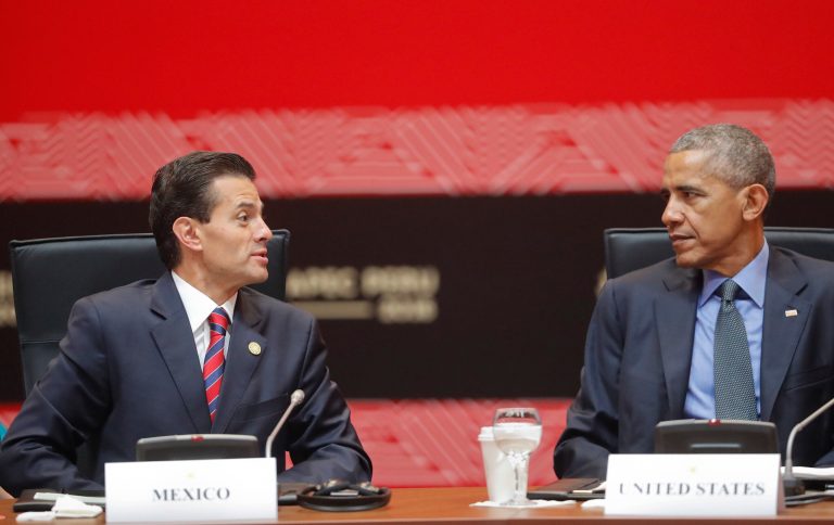 US President Barack Obama looks over to Mexico's President Enrique Pena Nieto attends a meeting with leaders of participating countries in the Trans-Pacific Partnership (TPP) in Lima, Peru, Saturday, Nov. 19, 2016. Obama will close a three-nation, post-U.S. election tour the same way he opened it: by reassuring leaders from around the world that U.S. democracy isn't broken and that everything will be fine when Republican Donald Trump succeeds him next year. (AP Photo/Pablo Martinez Monsivais)
