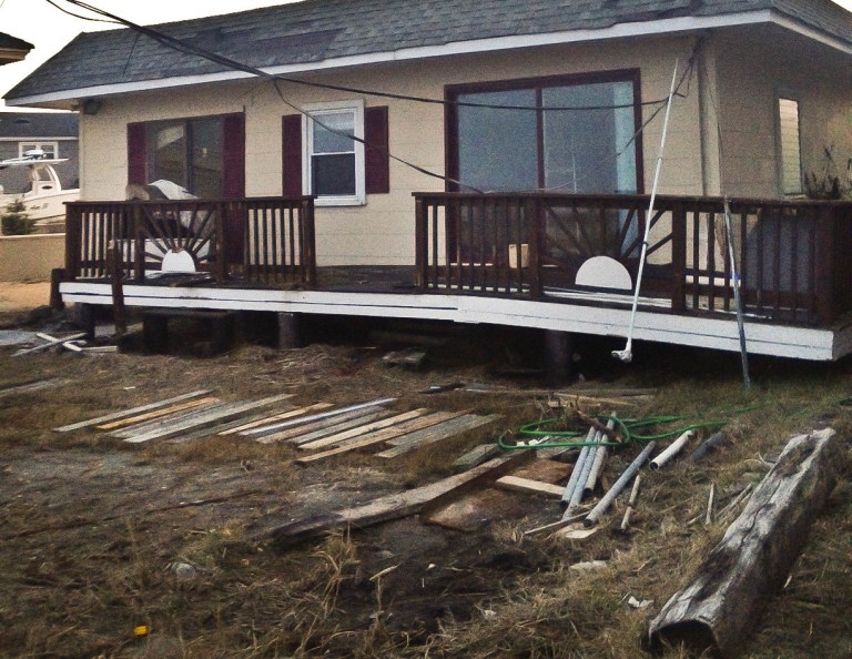   A Tuesday Dec. 4, 2012 photo shows the Bratek family cottage, which was damaged by Superstorm Sandy, in Brigantine, N.J. Families that inherited small homes on the New Jersey shore over the years are trying to decide whether it is possible to repair or rebuild after Superstorm Sandy. (AP Photo/Katie Zezima)  