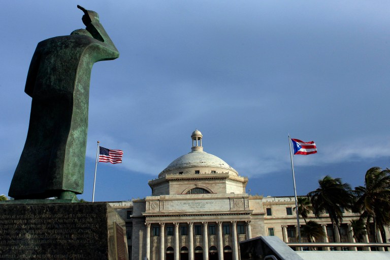 Puerto Rico has it's next debt payment — $1.9 billion — due on July 1. (AP Photo/Ricardo Arduengo, File)