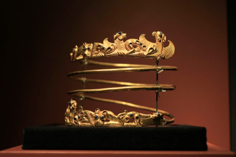 A spiraling torque from the second century A.D., is displayed as part of the exhibit called The Crimea - Gold and Secrets of the Black Sea, at Allard Pierson historical museum in Amsterdam Friday April 4, 2014. The museum has gotten more than the bronze swords, golden helmets and precious gems it bargained for as it is unsure where to return the collection after Russia annexed Crimea. (AP Photo/Peter Dejong)