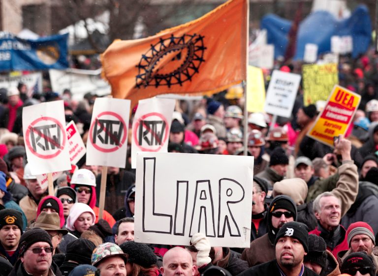 Union members from around the country rally at the Michigan State Capitol to protest a vote on Right-to-Work legislation December 11, 2012 in Lansing, Michigan. (Photo by Bill Pugliano/Getty Images)