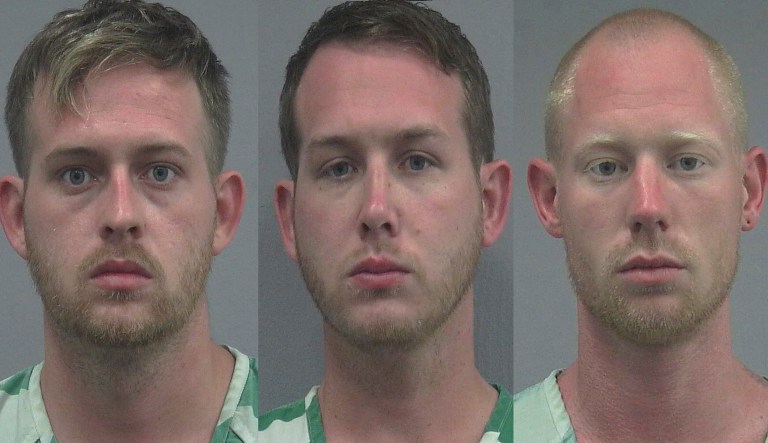 One of the anti-Spencer protesters smashed the back window of the suspects' vehicle with a baton and Tenbrink fired a round from a handgun. (AP)