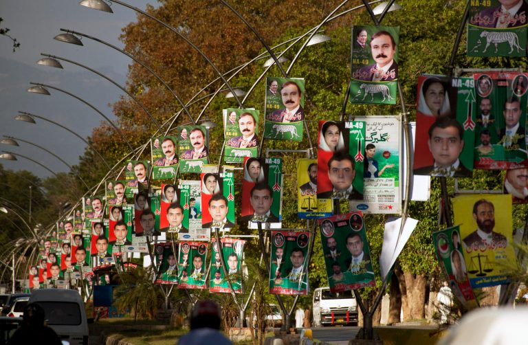 Roads in Islamabad are decorated with poster of candidates taking part in next month's parliamentary elections in Islamabad, Pakistan, Monday, April 29, 2013. Candidates restricted their election campaigns to corner meetings and social media due to ongoing attacks by Taliban on their offices and rallies of various political parties. (AP Photo/B.K. Bangash)