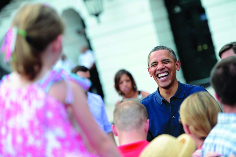 Extreme? That's what likely voters say of President Obama's views, according to a new poll. Here he is celebrating Independence Day with a picinic on the South Lawn of the White House. (Photo by Shawn Thew-Pool/Getty Images)