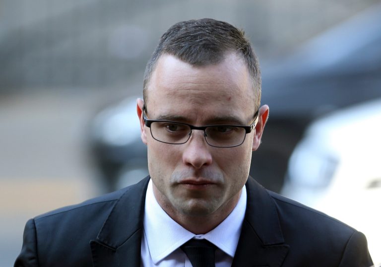 Oscar Pistorius arrives at the high court in Pretoria, South Africa, Monday, May 5, 2014. Pistorius' murder trial enters a critical phase Monday as his defense team attempts to recover from a faltering start and reinforce the disabled athlete's claim that he fatally shot girlfriend Reeva Steenkamp by mistake because he was overwhelmed by a long-held fear of violent crime. (AP Photo/Themba Hadebe)