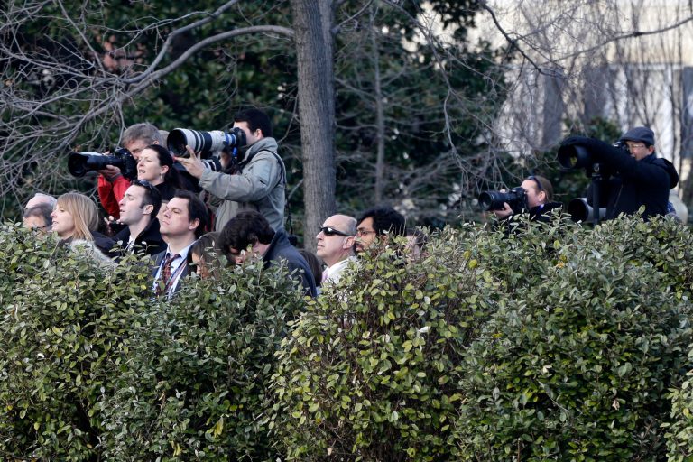 Reporters and photographers try to get a glimpse of Congressional leaders as they arrive at the White House in Washington, Friday, Dec. 28, 2012, for a closed-door meeting with President Barack Obama regarding the fiscal cliff. Two of the five worst jobs of the year involve journalism: broadcaster and newspaper reporter, according to a new report from CareerCast.com. (AP Photo/Charles Dharapak)