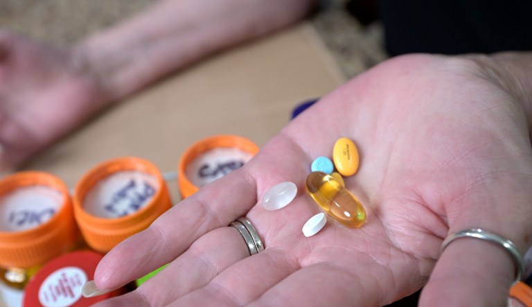 The pharmaceutical industry is bracing for a financial hit with the imminent passage of the Inflation Reduction Act. Retiree Donna Weiner shows some of the daily prescription medications that she needs and pays over $6,000 a year through a Medicare prescription drug plan at her home, Tuesday, Oct. 5, 2021, in Longwood, Fla. (AP Photo/Phelan M. Ebenhack)