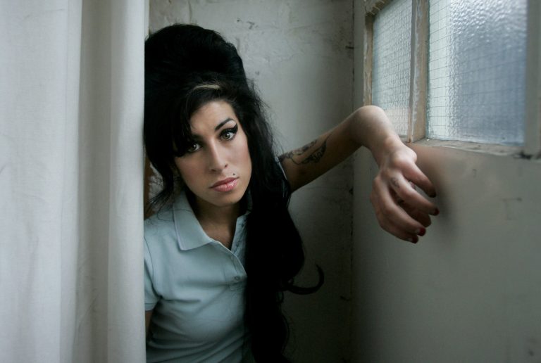   FILE - In this Feb. 16, 2007 file photo, British singer Amy Winehouse poses for a photograph at a studio in north London, Friday, Feb. 16, 2007. Rock 'n' roll will never die, but it's a hazardous occupation. A new study confirms that rock and pop musicians more often die prematurely than the general population, and an early death is twice as likely for solo musicians than for members of bands. (AP Photo/Matt Dunham, File)  