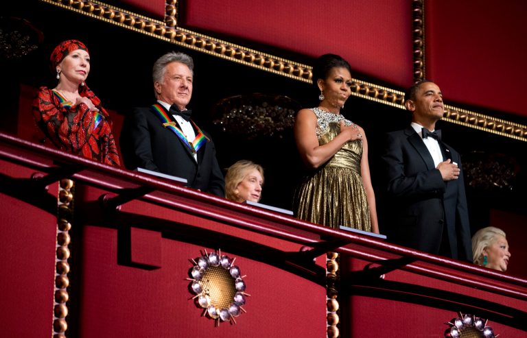   President Barack Obama, right, and first lady Michelle Obama, second from right, with the 2012 Kennedy Center Honors recipients, ballerina Natalia Makarova, left, and actor and director Dustin Hoffman, stand as the National Anthem is played during the Kennedy Center Honors Gala at the Kennedy Center in Washington, Sunday, Dec. 2, 2012. (AP Photo/Manuel Balce Ceneta)  