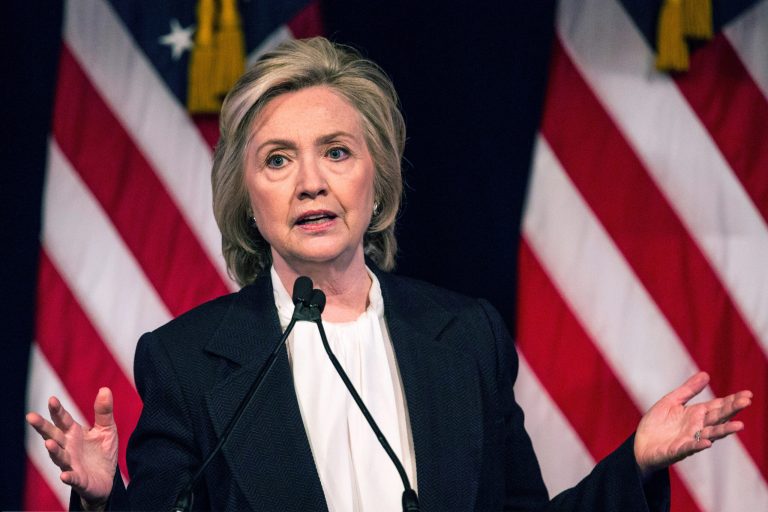 Clinton emphasized her compliance in the investigations process, before continuing on to her planned economic speech. (Getty)