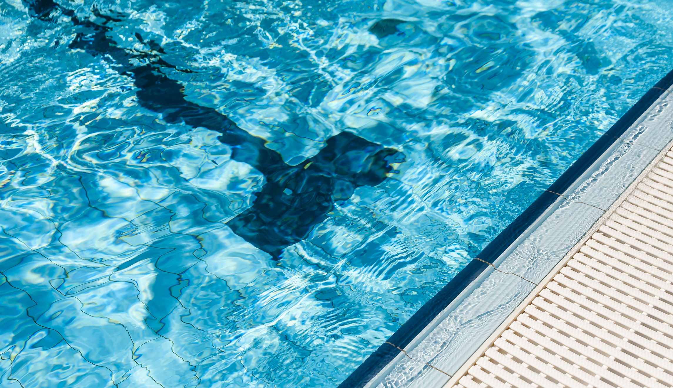 Homeland Security agents search home of Olympic swim coach accused of abusing minor