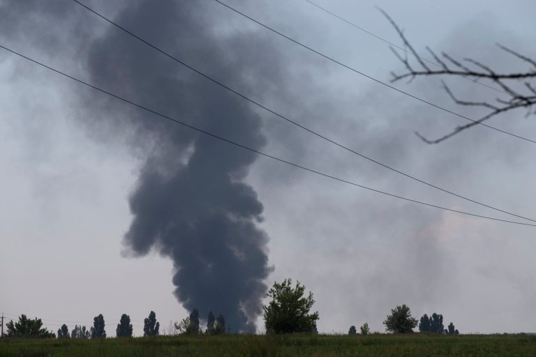 Black smoke rises from a shot down Ukrainian Army helicopter outside Slovyansk, Ukraine, Thursday, May 29, 2014. Rebels in eastern Ukraine shot down a government military helicopter Thursday amid heavy fighting around the eastern city of Slovyansk, killing 14 soldiers including a general, Ukraine's leader said. Acting President Oleksandr Turchynov told the parliament in Kiev that rebels used a portable air defense missile Thursday to down the helicopter and said that a General was among the dead. (AP Photo/Alexander Zemlianichenko)