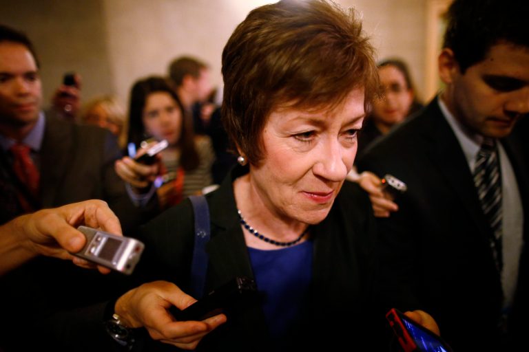 Sen. Susan Collins, R-Maine, is followed by reporters as she leaves a meeting of Senate Republicans regarding the government shutdown and debt ceiling on Capitol Hill in Washington, Saturday, Oct. 12, 2013. (AP Photo/Charles Dharapak)
