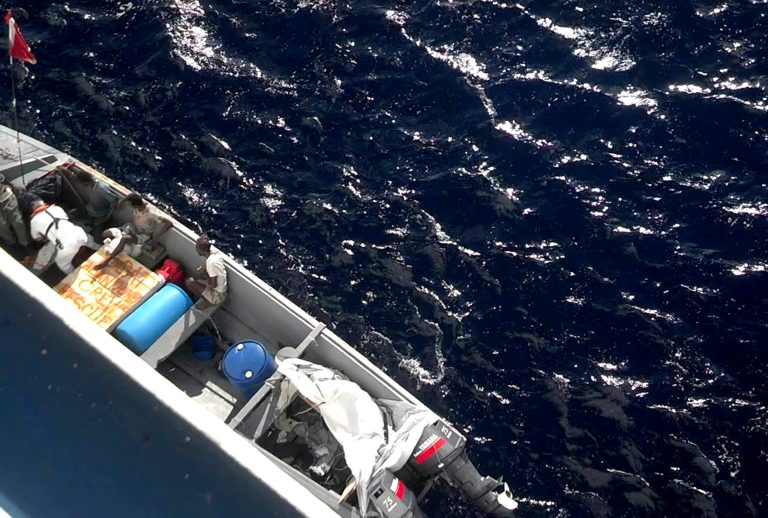   In this frame grab from a video provided by Andy Greenberg, a passenger aboard The Island Princess cruise ship, Monday, Dec. 17, 2012, shows five Jamaicans who have been drifting on a small boat in the Caribbean for three weeks were rescued Monday by a cruise ship, authorities said. The Island Princess ship brought the group on board, Princess Cruises spokeswoman Susanne Ferrull said. Ferrull did not immediately know their condition or ages. (AP Photo/Andy Greenberg)  