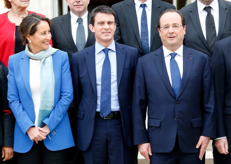 French President Francois Hollande, right,  new French Prime Minister Manuel Valls, center, and  Environment and Energy minister Segolene Royal pose during the family picture after the first weekly cabinet meeting after municipal elections, at the Elysee Palace in Paris, Friday, April 4, 2014. President Francois Hollande shook up the government this week after his Socialist Party suffered an electoral defeat in nationwide municipal elections. Among two new faces in the Cabinet is Segolene Royal, a longtime politician and mother of Hollande's children, as environment and energy minister. (AP Photo/Jacques Brinon)