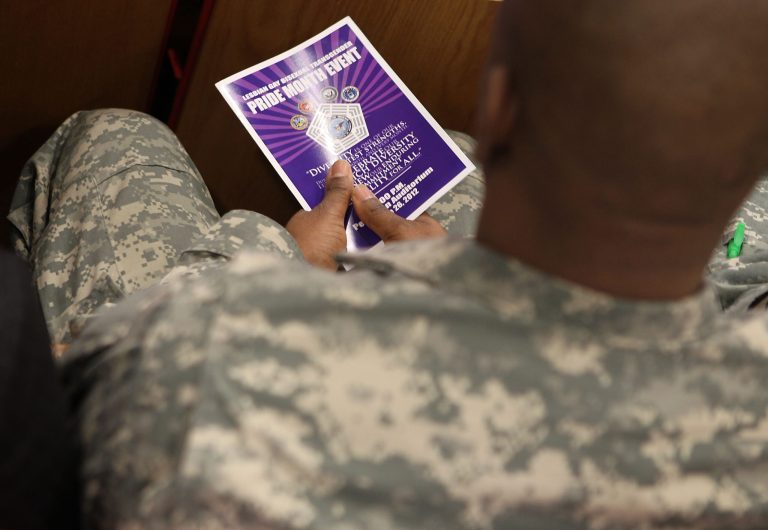 A U.S. service member sits in the audience during an event to observe 'Lesbian, Gay, Bisexual and Transgender Pride Month' June 26, 2012 at the Pentagon in Arlington, Va. (Getty Image)