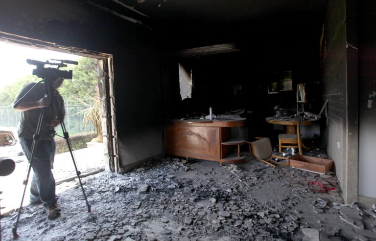 FILE - This Sept. 13, 2012 file photo shows a cameraman filming one of U.S. consulate burnt out offices after an attack that killed four Americans, including Ambassador Chris Stevens on the night of Tuesday, Sept. 11, 2012, in Benghazi, Libya. The U.S. has identified five men they believe might be behind the attack on the diplomatic mission in Benghazi, Libya, last year, and have enough evidence to justify seizing them by military force as suspected terrorists _ but not enough proof to try them in a U.S. civilian criminal court, the process the Obama administration prefers, U.S. officials said. (AP photo/Mohammad Hannon, File)