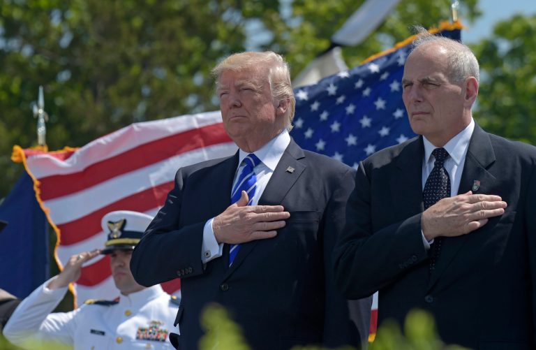 President Donald Trump and Homeland Security Secretary John Kelly listen to the national anthem during commencement exercises at the U.S. Coast Guard Academy in New London, Conn., Wednesday, May 17, 2017. Kelly becomes Trump's chief of staff starting Monday. (AP Photo/Susan Walsh)