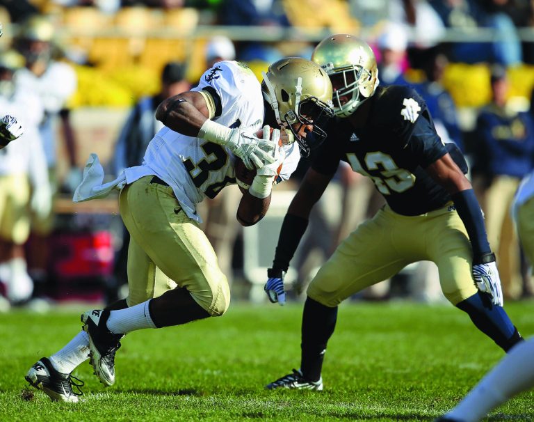 Jonathan Daniel/Getty Images
John Howell #33 of the Navy Midshipmen runs against Josh Atkinson #43 of the Notre Dame Fighting Irish.at Notre Dame Stadium on October 29, 2011 in South Bend, Indiana. Notre Dame defeated Navy 56-14.
