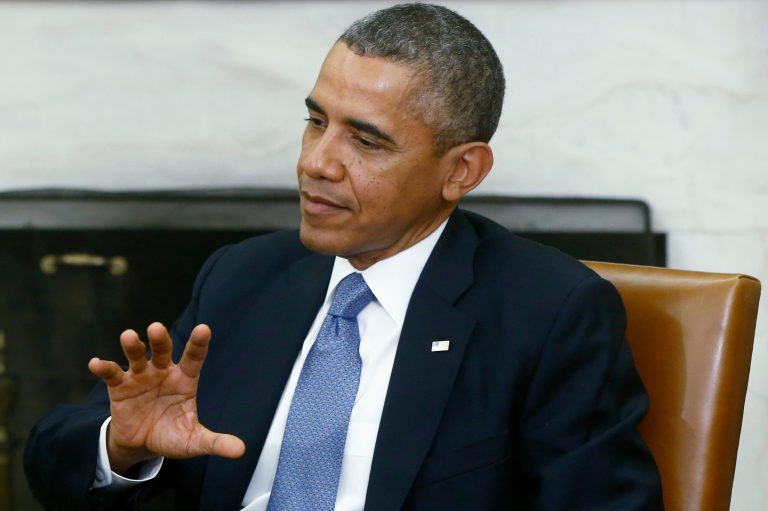   President Barack Obama answers a question about the looming federal government shutdown from a reporter during his meeting with Israeli Prime Minister Benjamin Netanyahu in the Oval Office of the White House in Washington, Monday, Sept. 30, 2013. (AP Photo/Charles Dharapak)  