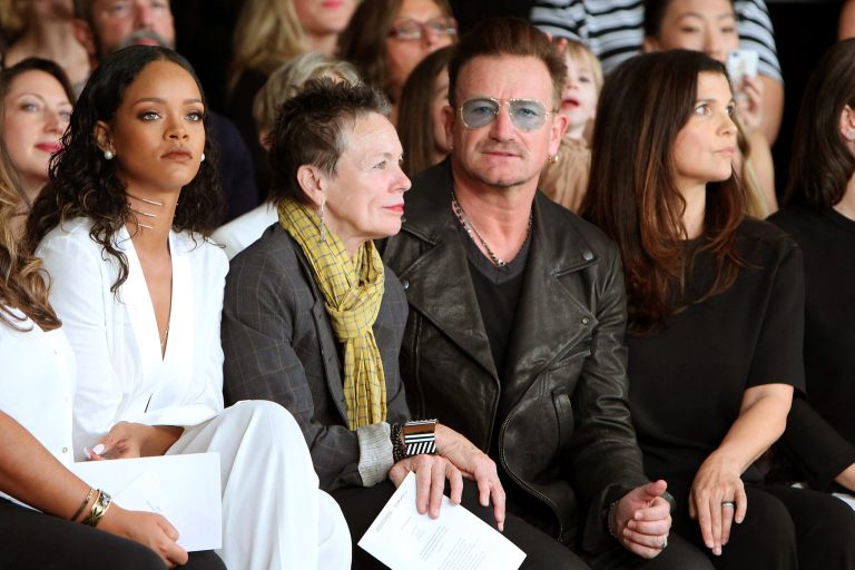In this image released by Starpix, Rihanna, from left, Laurie Anderson, Bono and Ali Hewson sit in the front row at the Edun Spring 2015 collection, Sunday, Sept 7, 2014, during Fashion Week in New York. (AP Photo/Starpix, Kristina Bumphrey)