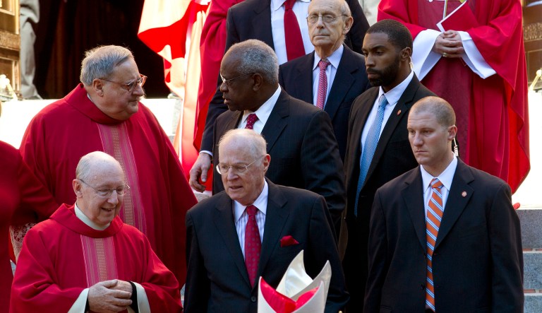 Supreme Court Justices Stephen Breyer, top, Clarence Thomas, center, and Anthony Kennedy, leave St. Mathews Cathedral, after the Red Mass in Washington. The Supreme Court's new term starts Monday. (AP Photo/Jose Luis Magana)