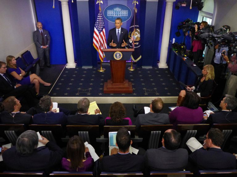 President Barack Obama speaks about the the budget and the partial government shutdown, Tuesday, Oct. 8, 2013, in the Brady Press Room of the White House in Washington. The president said he told House Speaker John Boehner he's willing to negotiate with Republicans on their priorities, but not under the threat of 