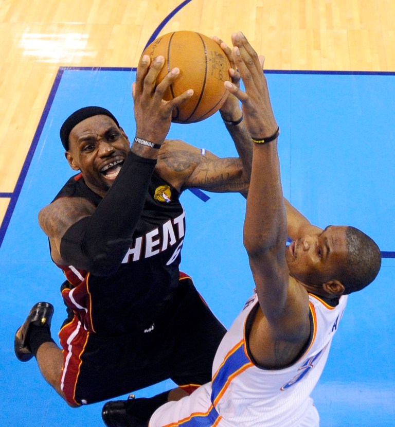  Miami Heat small forward LeBron James is defended by Oklahoma City Thunder small forward Kevin Durant (35) during the second half at Game 2 of the NBA finals basketball series, Thursday, June 14, 2012, in Oklahoma City. The Heat won 100-96. (AP Photo/Larry W. Smith, Pool)  
