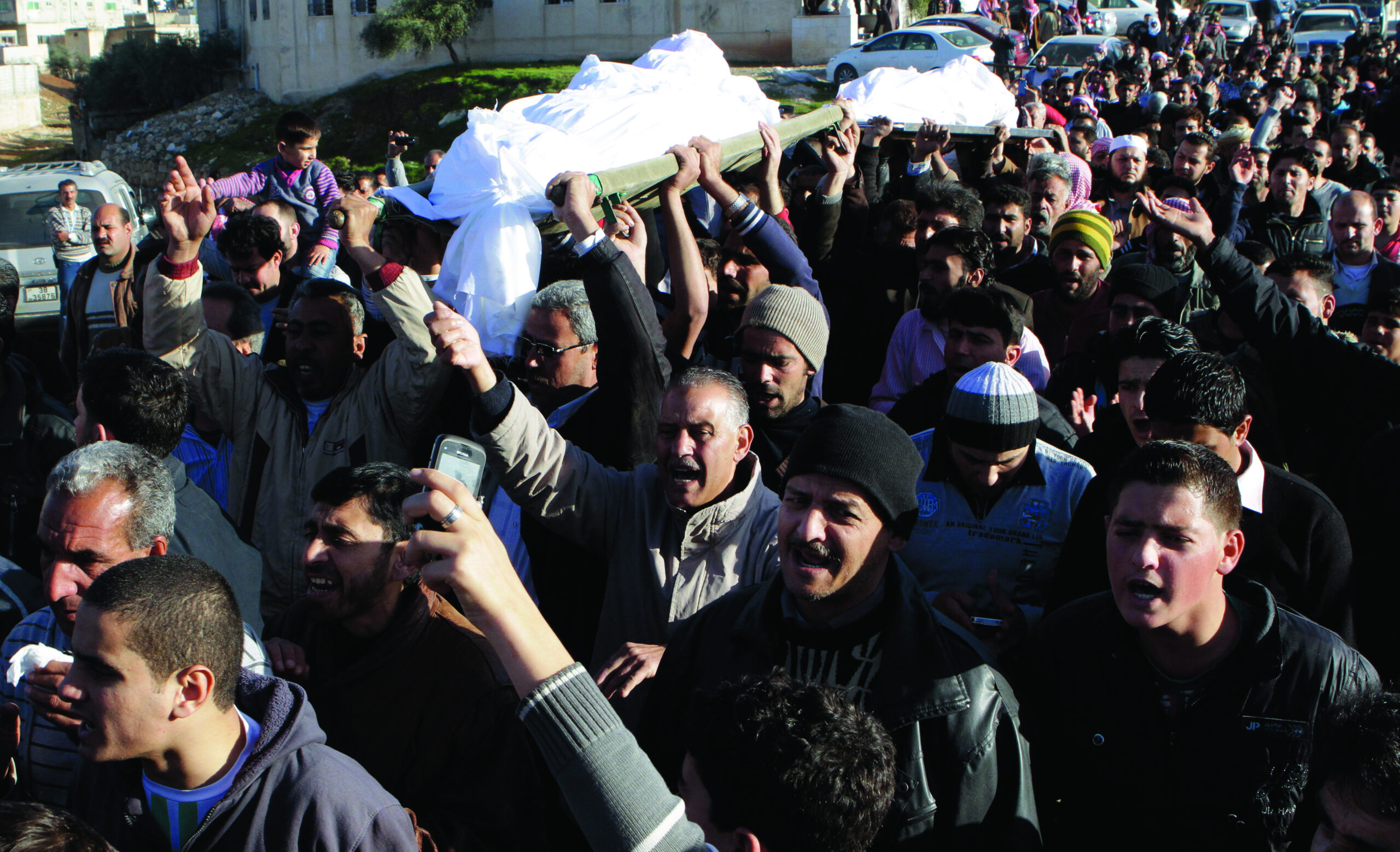 Syrian pro-regime gunmen kill more than 100