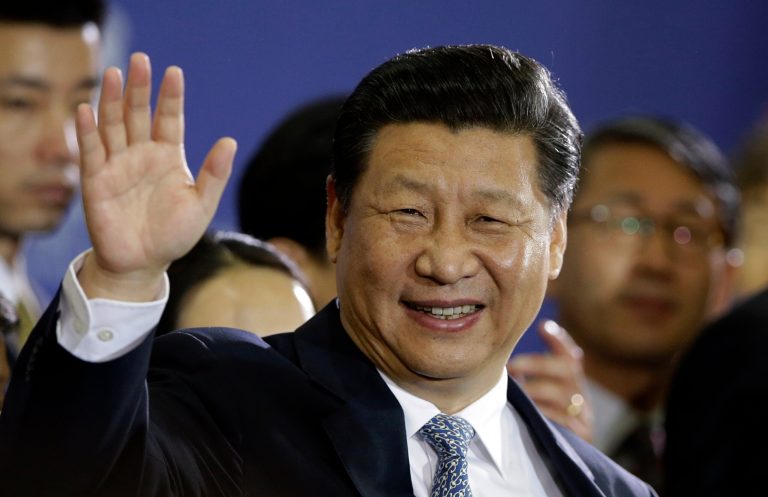 Chinese President Xi Jinping waves to students and audience after his lecture at Seoul National University in Seoul, South Korea, Friday, July 4, 2014. With a single meeting Thursday, the leaders of China and South Korea simultaneously snubbed North Korea, bolstered their already booming trade relationship and gave the U.S. and Japan a look at Beijing's growing influence south of the Korean Demilitarized Zone. (AP Photo/Lee Jin-man)