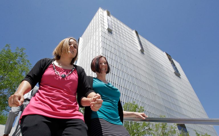 The decision does mean states that require certain spousal benefits must now ensure the requirements extend to same-sex spouses, legal and policy experts say. (AP Photo)Â 