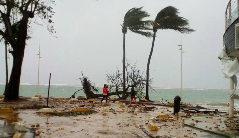 Hurricane Maria made landfall in the U.S. Virgin Islands on Tuesday night as a Category 5 storm before bringing heavy rain, high winds and flooding to Puerto Rico on Wednesday morning. (AP Photo/Dominique Chomereau-Lamotte)