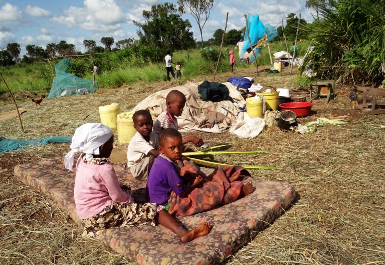 Children displaced from their village by the recent attacks sit on a mattress next to their parents' belongings, at the Kitale-Mavuno Internally Displaced Persons camp where hundreds of residents from the villages of Kaisari, Pangani and Poromoko have taken refuge, near Mpeketoni on the north coast of Kenya Thursday, June 19, 2014. Kenya's top opposition leader Raila Odinga said Wednesday that a statement by the country's president Uhuru Kenyatta that local political networks were responsible for two days of killings that left 60 people dead, and that they were not carried out by the Somali militant group al-Shabab, trivialized the massacre and went against the conclusions of security experts and foreign governments. (AP Photo)