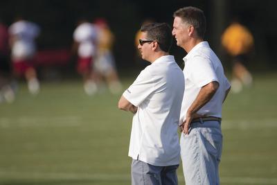 Evan Vucci/AP
Owner Daniel Snyder, left, general manager Bruce Allen and the Washington Redskins lost$36 million from their salary cap.